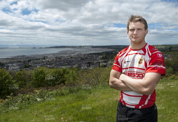 220513 - Ospreys - Pictured with Swansea Bay in the background is Dan Biggar in Gorseinon RFC kit