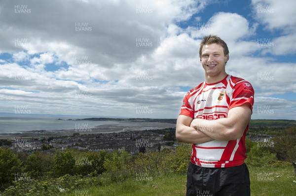 220513 - Ospreys - Pictured with Swansea Bay in the background is Dan Biggar in Gorseinon RFC kit