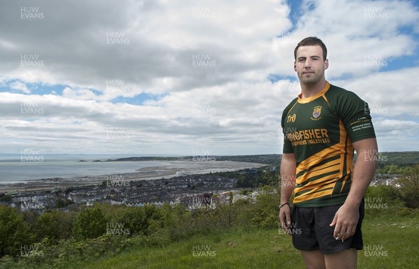 220513 - Ospreys - Pictured with Swansea Bay in the background is Scott Baldwin in Bridgend Athletic RFC kit