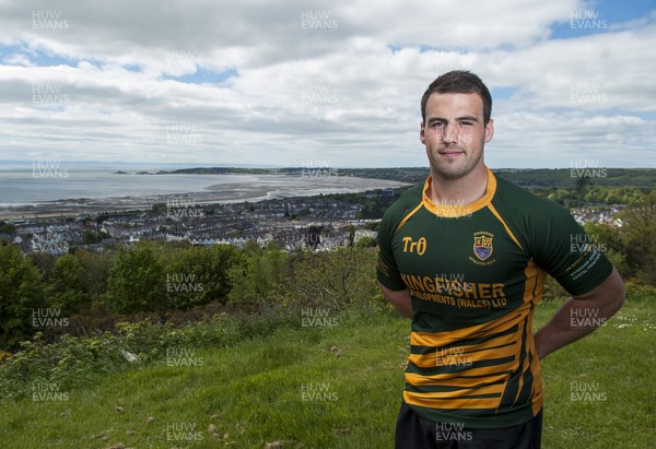 220513 - Ospreys - Pictured with Swansea Bay in the background is Scott Baldwin in Bridgend Athletic RFC kit