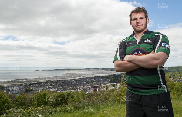 220513 - Ospreys - Pictured with Swansea Bay in the background is Ryan Bevington in Porthcawl kit