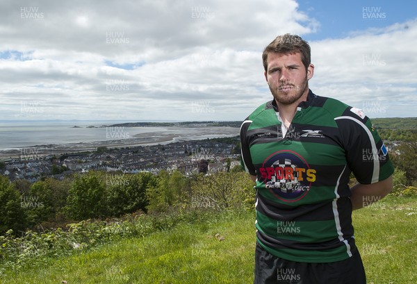 220513 - Ospreys - Pictured with Swansea Bay in the background is Ryan Bevington in Porthcawl kit