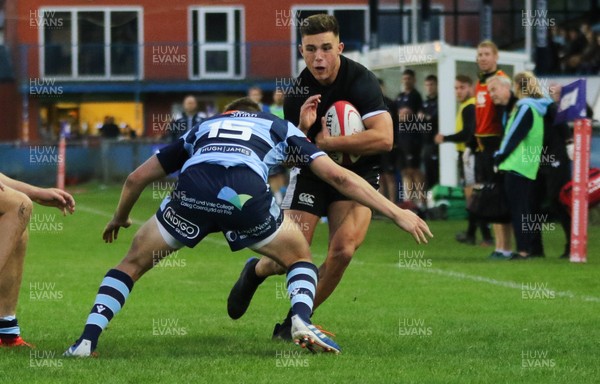 130919 - Ospreys Development v Cardiff Blues A, Celtic Cup - Dewi Cross of Ospreys Development is tackled by Jacob Beetham of Cardiff Blues A