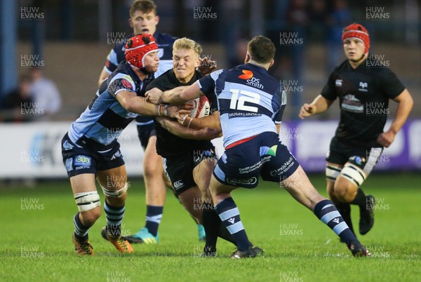 130919 - Ospreys Development v Cardiff Blues A, Celtic Cup - Ben Cambriani of Ospreys Development is tackled by Josh Male of Cardiff Blues A and James Botham of Cardiff Blues A