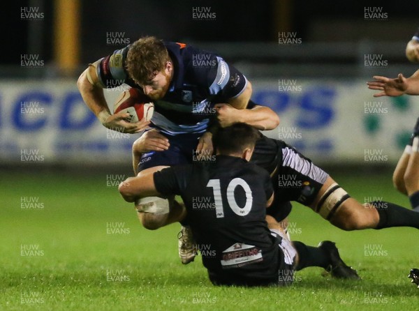 130919 - Ospreys Development v Cardiff Blues A, Celtic Cup - Tim Grey of Cardiff Blues A is tackled by Josh Thomas of Ospreys Development