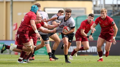 150918 - Ospreys Development v Munster A - Celtic Cup - Dewi Cross of Ospreys is tackled by Jeremy Loughman of Munster