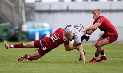 150918 - Ospreys Development v Munster A - Celtic Cup - Kieran Williams of Ospreys is tackled by Alex McHenry of Munster