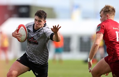 150918 - Ospreys Development v Munster A - Celtic Cup - Callum Carson of Ospreys is tackled by Matt More of Munster