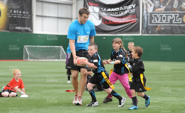 040812 - Ospreys Open Day -Ryan Jones plays tag rugby with youngsters