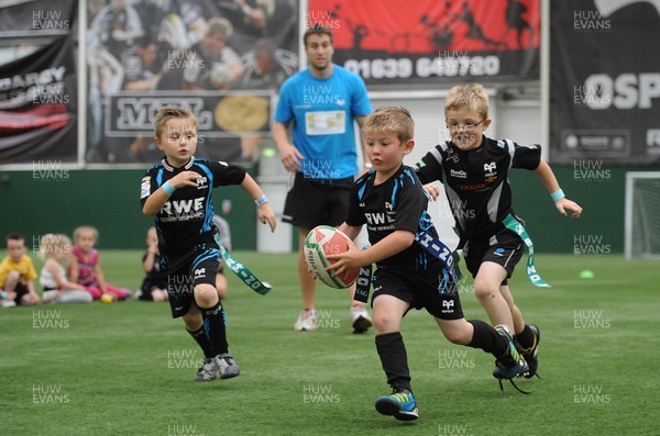 040812 - Ospreys Open Day -Ryan Jones plays tag rugby with youngsters