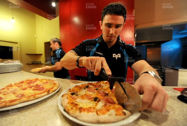 09.01.12 - Ospreys - Kristian Phillips participating in a pizza cook-off challenge at Mamma Mia in Swansea ahead of the Ospreys game against Benetton Treviso on Friday. 