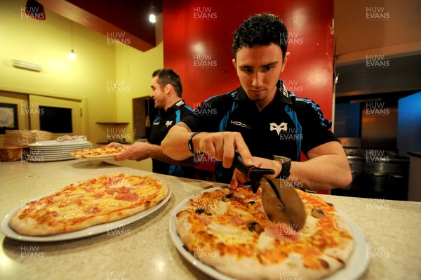 09.01.12 - Ospreys - Kristian Phillips participating in a pizza cook-off challenge at Mamma Mia in Swansea ahead of the Ospreys game against Benetton Treviso on Friday. 