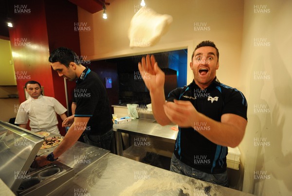 09.01.12 - Ospreys - Huw Bennett and Jonathan Thomas(L) participating in a pizza cook-off challenge at Mamma Mia in Swansea ahead of the Ospreys game against Benetton Treviso on Friday. 