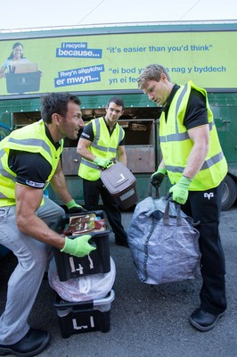 290714 -  Ospreys, Joe Bearman, Tom Habberfield and  Jonathan Spratt help out on the council's household recycling collection in Maesteg 