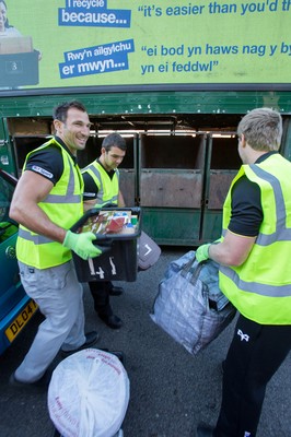 290714 -  Ospreys, Joe Bearman, Tom Habberfield and  Jonathan Spratt help out on the council's household recycling collection in Maesteg 