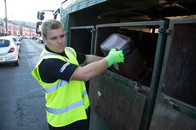 290714 -  Ospreys players take part in the council's household recycling collection in Maesteg