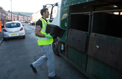 290714 -  Ospreys players take part in the council's household recycling collection in Maesteg