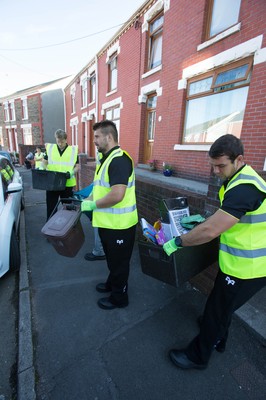 290714 -  Ospreys players take part in the council's household recycling collection in Maesteg