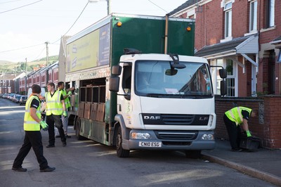 290714 -  Ospreys players take part in the council's household recycling collection in Maesteg