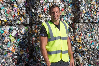 290714 -  Ospreys players take part in the council's household recycling collection in Maesteg