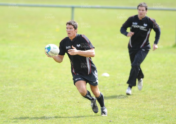 10.04.09 - Ospreys Rugby Training - James Hook makes a pass during training. 