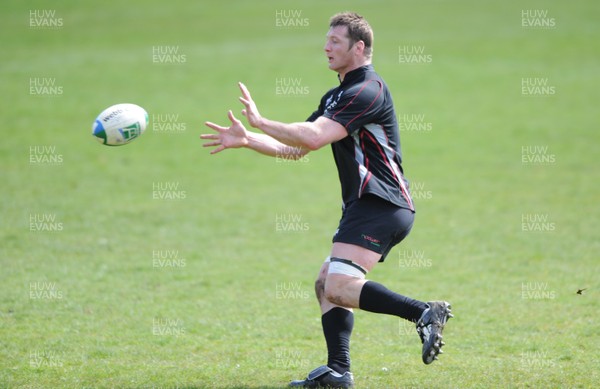 10.04.09 - Ospreys Rugby Training - Ian Gough takes a pass during training. 