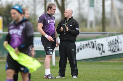 160212 - Ospreys Rugby Training -Ospreys head coach Steve Tandy talks to Alun Wyn Jones(L) during training