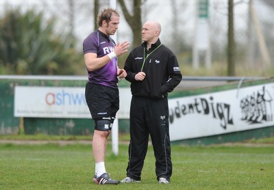 160212 - Ospreys Rugby Training -Ospreys head coach Steve Tandy talks to Alun Wyn Jones(L) during training