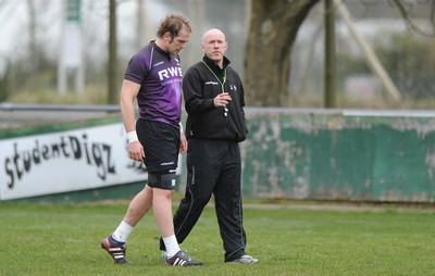 160212 - Ospreys Rugby Training -Ospreys head coach Steve Tandy talks to Alun Wyn Jones(L) during training