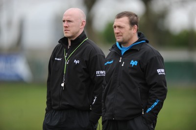 160212 - Ospreys Rugby Training -Ospreys head coach Steve Tandy talks to forwards coach Jonathan Humphreys(R) during training