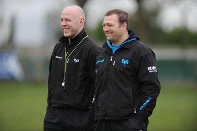 160212 - Ospreys Rugby Training -Ospreys head coach Steve Tandy talks to forwards coach Jonathan Humphreys(R) during training