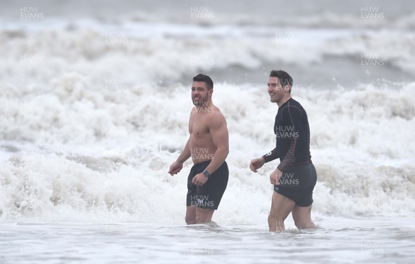 150118 - Ospreys Rugby Sea Recovery - Rhys Webb and James Hook of Ospreys in the sea at Aberavon beach ahead of their qualifying game against Clermont Auvergne