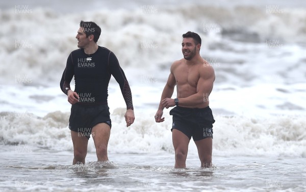 150118 - Ospreys Rugby Sea Recovery - James Hook and Rhys Webb of Ospreys in the sea at Aberavon beach ahead of their qualifying game against Clermont Auvergne