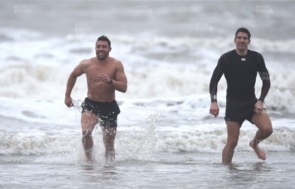 150118 - Ospreys Rugby Sea Recovery - Rhys Webb and James Hook of Ospreys in the sea at Aberavon beach ahead of their qualifying game against Clermont Auvergne