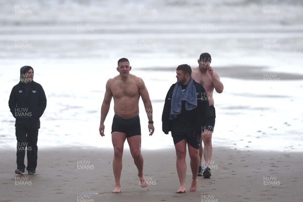150118 - Ospreys Rugby Sea Recovery - Lloyd Ashley and Scott Otten of Ospreys after coming out of the sea at Aberavon beach ahead of their qualifying game against Clermont Auvergne