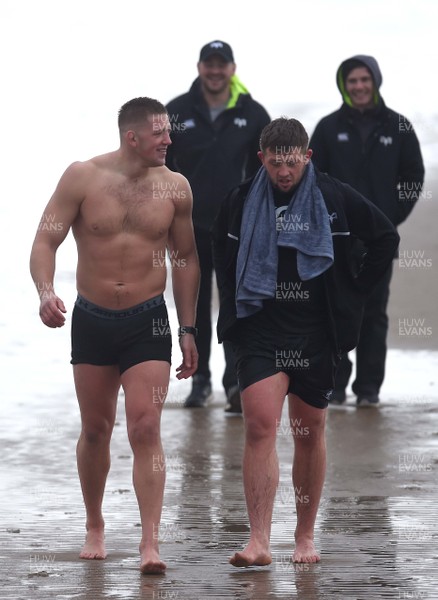 150118 - Ospreys Rugby Sea Recovery - Lloyd Ashley and Scott Otten of Ospreys after coming out of the sea at Aberavon beach ahead of their qualifying game against Clermont Auvergne
