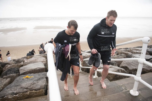 150118 - Ospreys Rugby Sea Recovery - Ashley Beck and Bradley Davies after coming out of the sea at Aberavon beach ahead of their qualifying game against Clermont Auvergne