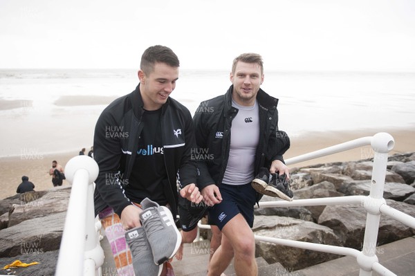 150118 - Ospreys Rugby Sea Recovery - Owen Watkin and Dan Biggar after coming out of the sea at Aberavon beach ahead of their qualifying game against Clermont Auvergne