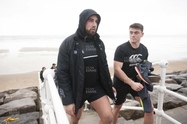 150118 - Ospreys Rugby Sea Recovery - Scott Baldwin and Reuben Morgan-Williams after coming out of the sea at Aberavon beach ahead of their qualifying game against Clermont Auvergne