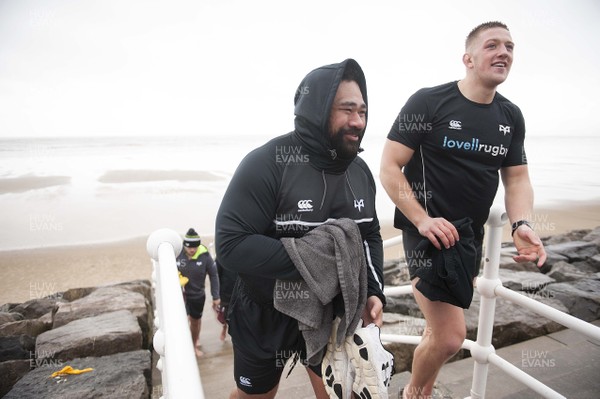 150118 - Ospreys Rugby Sea Recovery - Ma'afu Fia and Lloyd Ashley of Ospreys after coming out of the sea at Aberavon beach ahead of their qualifying game against Clermont Auvergne