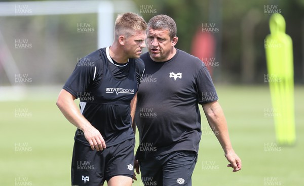 270721 - Ospreys Training session - Gareth Anscombe with head coach Toby Booth during training session