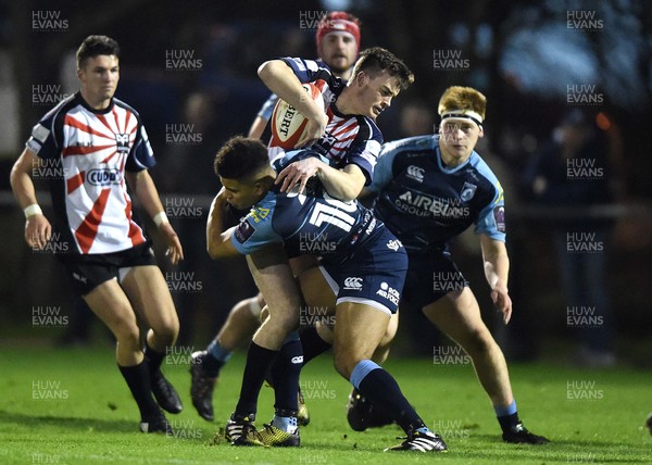 180117 - Ospreys Under 18s v Blues Under 18s - Cai Evans of Ospreys is tackled by Ben Thomas of Blues by Ben Evans/Huw Evans Agency