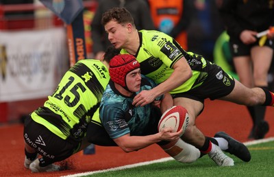 160225  Ospreys U18s v Dragons U18s, WRU Regional Age Grade Semi Final - Evan Jones of Ospreys is tackled by Harry Dawes of Dragons and Rhys Cole of Dragons