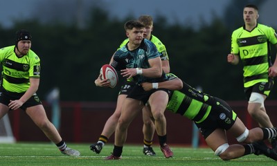 160225  Ospreys U18s v Dragons U18s, WRU Regional Age Grade Semi Final - Jack Hoskins of Ospreys is tackled by Elliot Beaven of Dragons