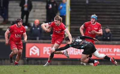 080226 - Ospreys U18 v Scarlets U18, WRU Regional Age Grade Championship - James Bentley of Scarlets gets past Nick Fisk Jones of Ospreys