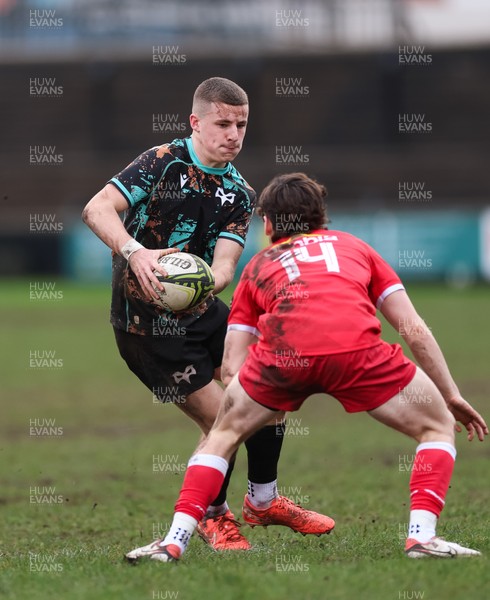 080226 - Ospreys U18 v Scarlets U18, WRU Regional Age Grade Championship - Dylan Quinn of Ospreys takes on Rhys Jones of Scarlets