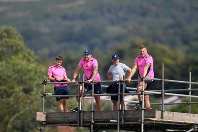 240825 - Ospreys U18s v Cardiff Rugby U18s - Cardiff Coaches watch the match from the scafolding 