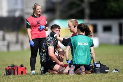240825 - Ospreys U18s v Cardiff Rugby U18s - Sam Morgan of Ospreys goes down to recieve treatment  