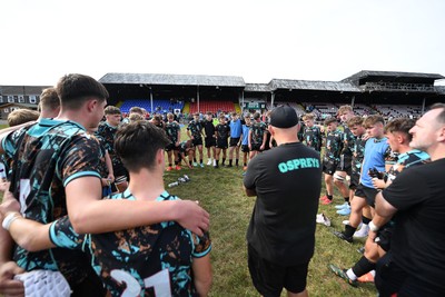 240825 - Ospreys U18s v Cardiff Rugby U18s - Ospreys team huddle at full time 