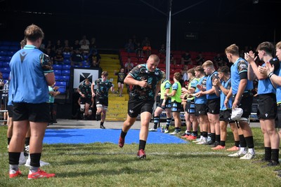 240825 - Ospreys U18s v Cardiff Rugby U18s - Ospreys players run out at the start of the match 